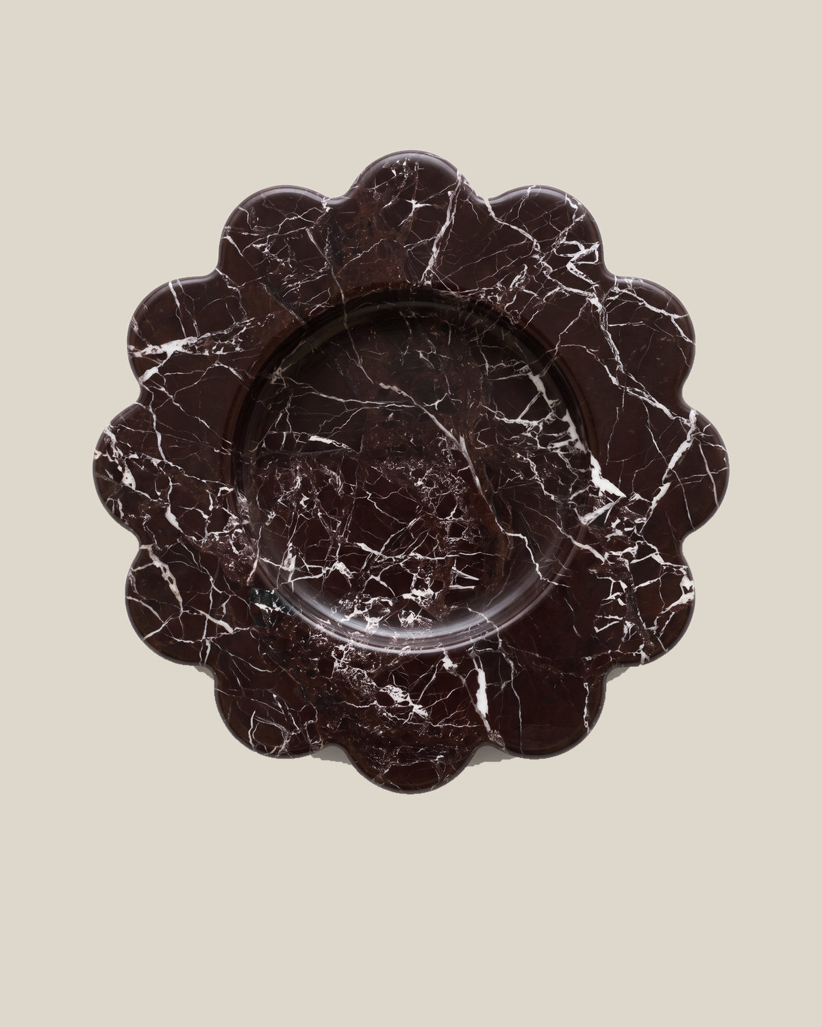 ATOMS Mini Sun Tray in Rosso Levante, near-top view on BONE background; 12.5 cm diameter and 2 cm thick.