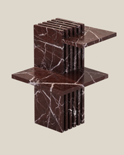 PIANO Side Table by CARVINGS in Rosso Levante Marble on a BONE background.