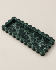Three-quarter view of the Slim Tiffany+ Tray in Green Marble, showing scalloped edges and recessed centre.