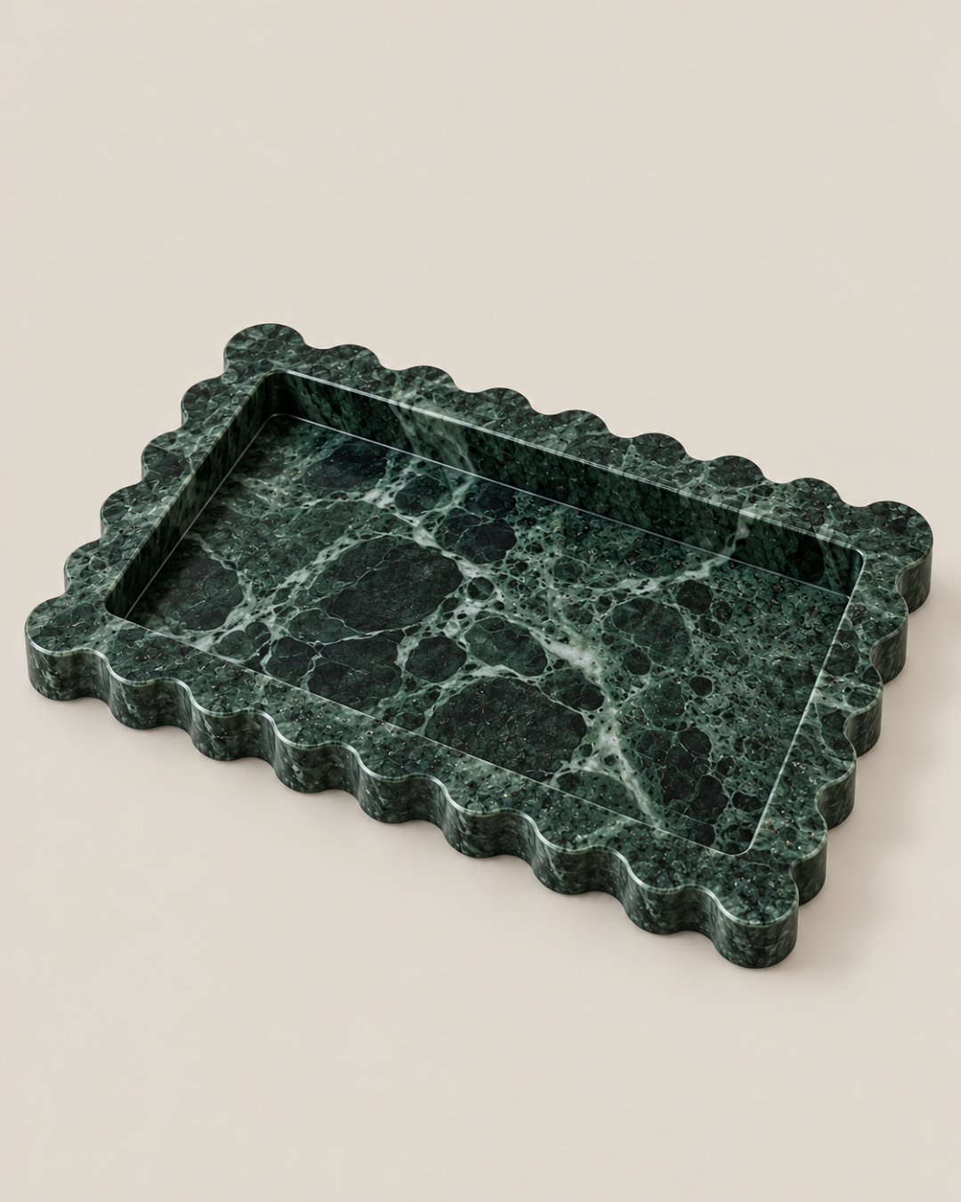 Three-quarter view of the Wide Tiffany+ Tray in Green Marble, showing scalloped edges and recessed centre.