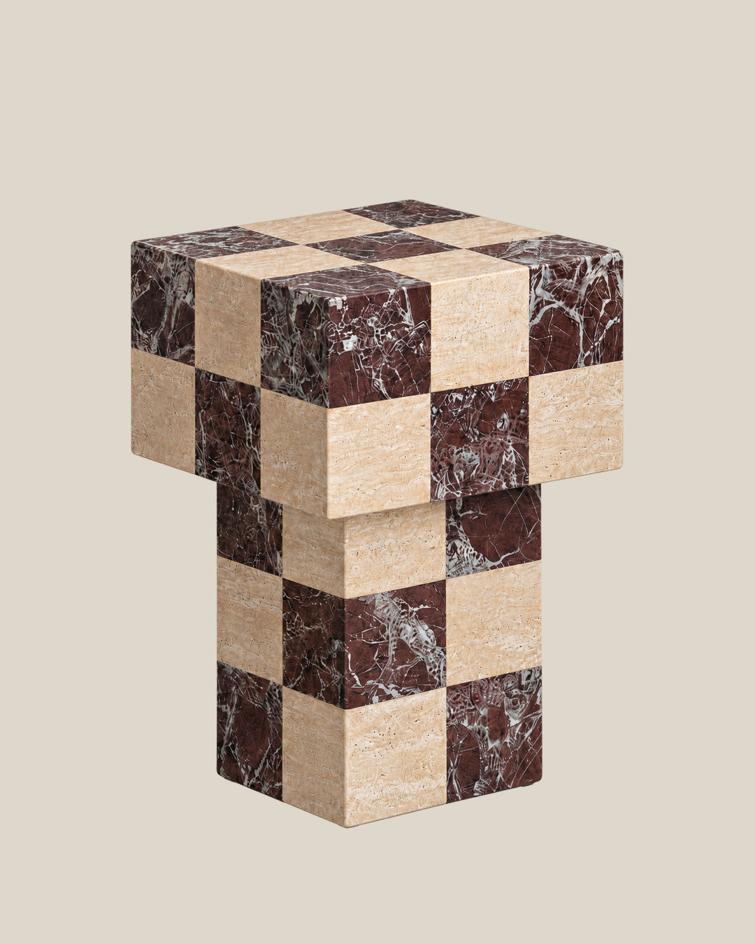 BUTTER side table by CARVINGS in Chequered Rosso Levante & Travertine Beige, on a BONE background, right view.