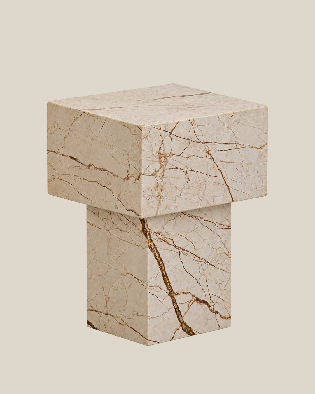 BUTTER side table by CARVINGS in Sofita Beige Marble, on a BONE background, right view.