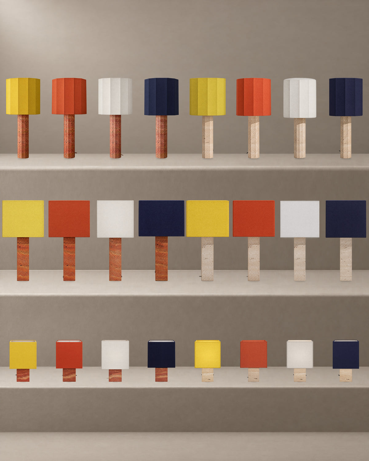 All 24 Roma Table Lamp variants together in the studio hero. Large Faceted and Large Square at 85 cm; Small Square at 44 cm. Both travertine bases and all four chapeau colours.