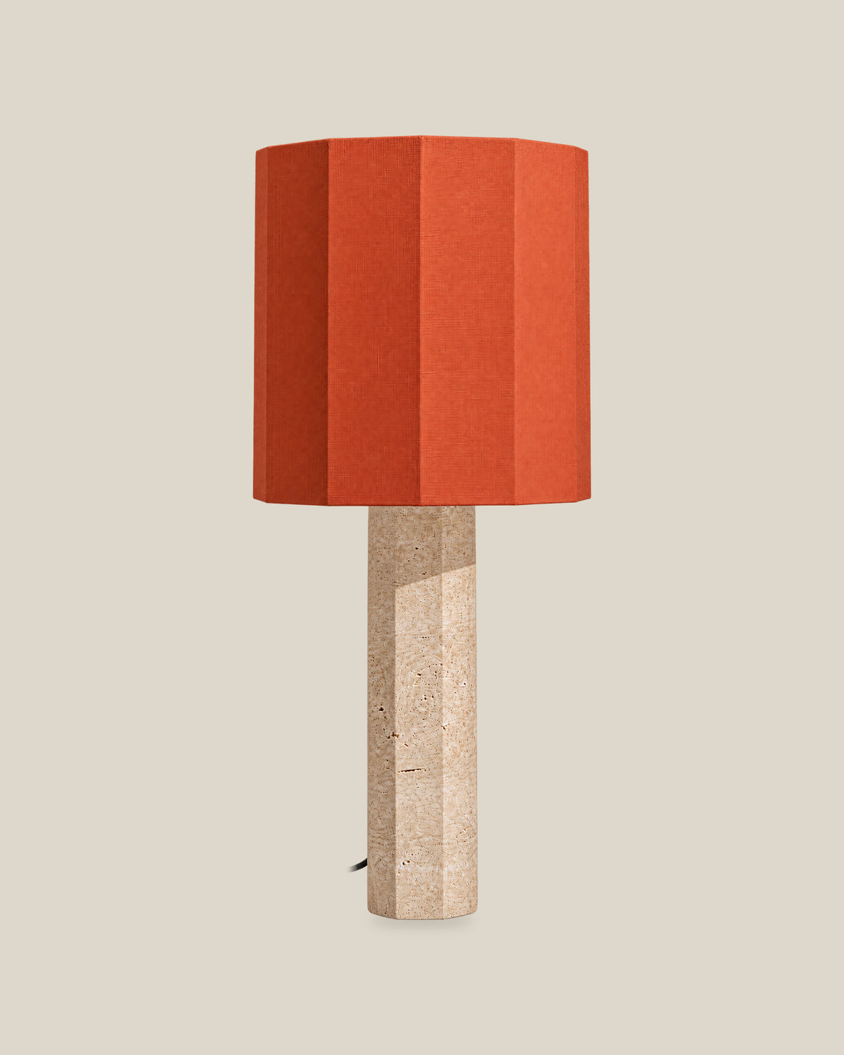 Roma Table Lamp, Large Faceted, Travertine Beige + Terracotta, front hero view on bone background.