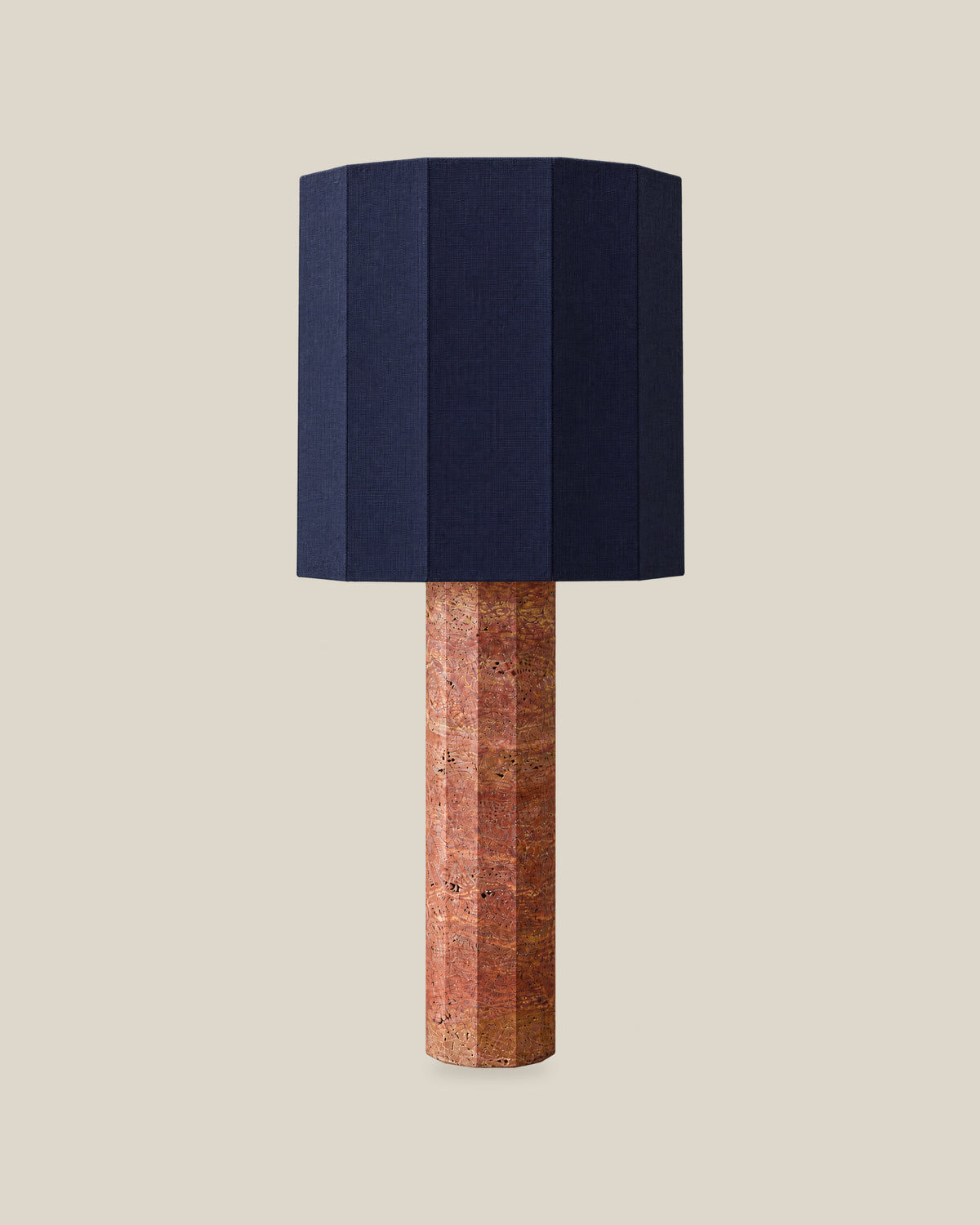 Roma Table Lamp, Large Faceted, Travertine Red + Dark Blue, front hero view on bone background.