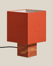 Roma Table Lamp, Small Square, Travertine Red + Terracotta, on a bone background.