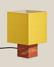 Roma Table Lamp, Small Square, Travertine Red + Yellow, on a bone background.