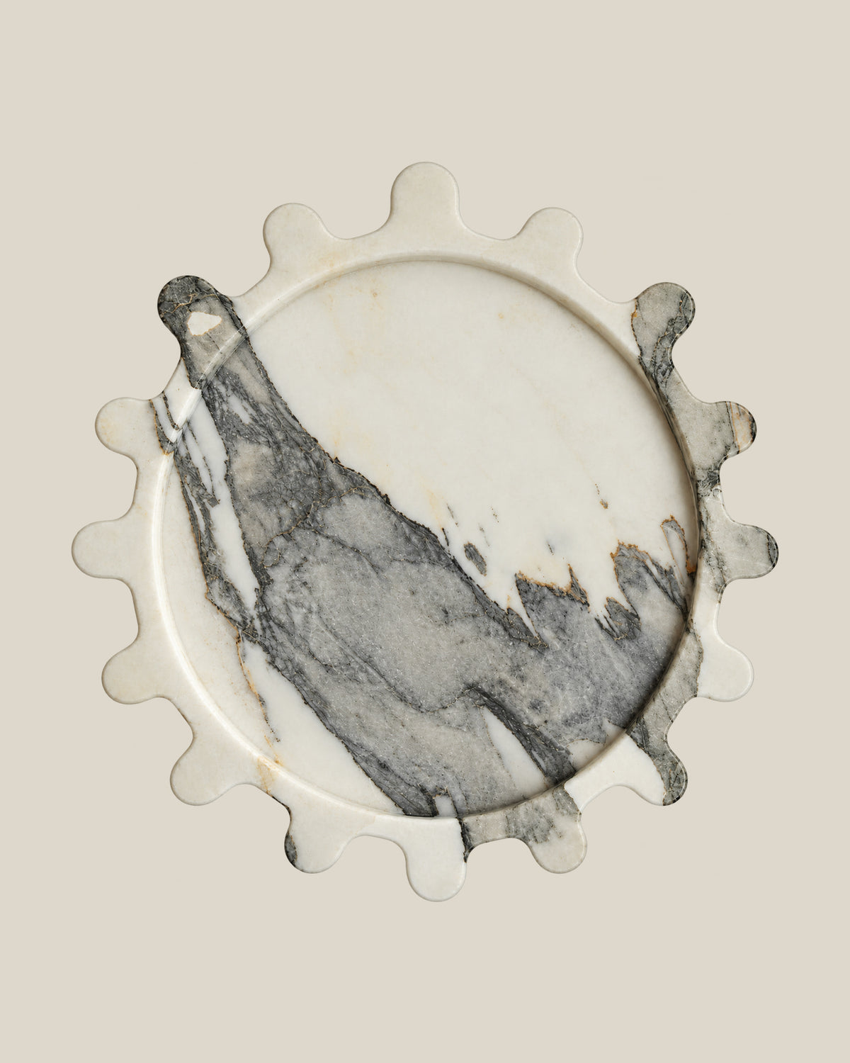 Sun Orbit Tray in Limited Edition Calacatta Borghini natural marble, overhead view, rounded sun rays and recessed circular centre.